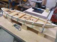 Bluenose in framing jig with main railing glued to the hull