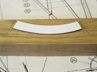 Brake pad template traced on oak